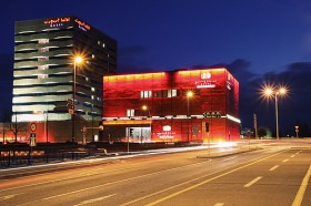 Grand Casino Basel lit up in red 