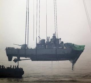 South Korean vessel being lifted out of the sea by a large sea crane - Photo By : AP