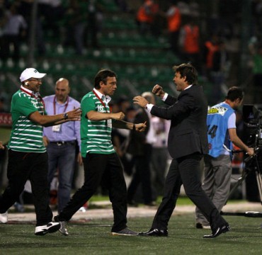 Bursaspor Manager Ertugrul Saglam just before being swamped by players celebrating the championship