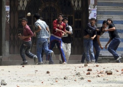 Kashmir Stone Throwing Protesters hurling stones, an act which has become popular in riots protests against the government.