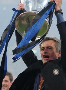Mourinho lifts the Champions League Cup after his side beat Bayern Munich at the Burnabough which he is almost certain to go next season.