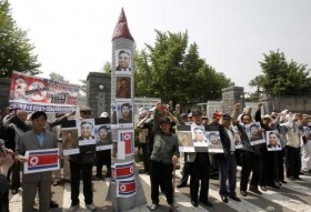 Protesters outside the South Korean Defence Ministry shouting anti-North Korean slogans - Photo by :  AP