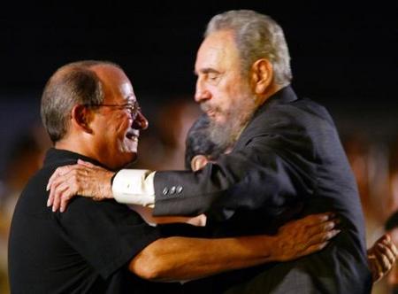 Latin American legend, Silvio Rodriguez and Cuban president Fidel Castro hug in a concert in 2004  - Photo by : AP/Jose Goitia