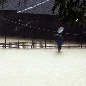 Residents in flood waters in Western Myanmar - Photo by : AP
