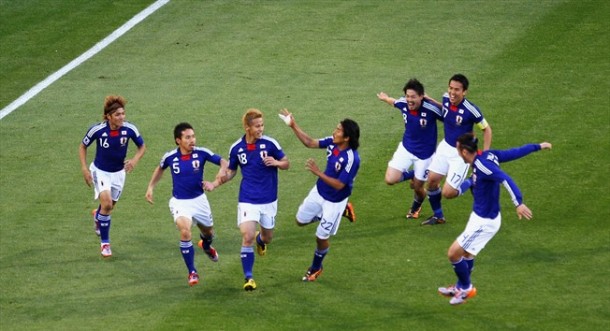 Japan celebrate after goal which beat Cameroon and landed the Asian side with three points