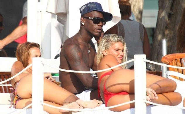 Mario Balotelli : girlfriend pregnant as the bad boy enjoys what Ibiza throws at him