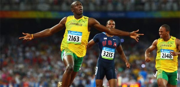 Usain Bolt celebrates as he crosses the line in the Men's 100meters race final at the Beijing Olympics 2008 leaving the competition in dust