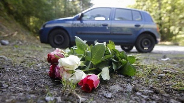 Flowers are seen on the crime scene where four people have been shot to death in a British-registered car, in a forest in the Alps, near Chevaline, French Flowers are seen on the crime scene where four people have been shot to death in a British-registered car, in a forest in the Alps, near Chevaline, French