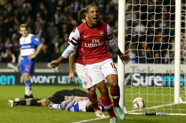Main man: Arsenal's Theo Walcott celebrates as he helps his side to a stunning victory Main man: Arsenal's Theo Walcott celebrates as he helps his side to a stunning victory