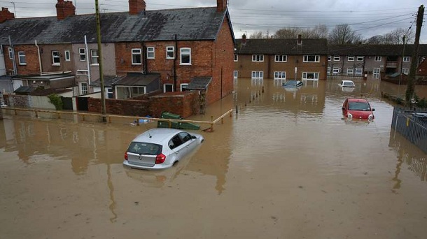 ST ASAPH, UNITED KINGDOM - NOVEMBER 27: Flood water covers the streets of St Asaph in North Wales after torrential overnight rain on November 27, 2012 in St Asaph, Wales. Residents in up to 500 homes in St Asaph have been advised to evacuate as flood waters continue to rise and the River Elwy breaks its banks. ST ASAPH, UNITED KINGDOM - NOVEMBER 27: Flood water covers the streets of St Asaph in North Wales after torrential overnight rain on November 27, 2012 in St Asaph, Wales. Residents in up to 500 homes in St Asaph have been advised to evacuate as flood waters continue to rise and the River Elwy breaks its banks.