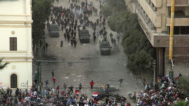 Egyptian anti-riot police clash with protesters demonstrating against Egypt's Islamist President Mohamed Morsi in Cairo's landmark Tahrir square on November 23, 2012. Morsi has assumed temporary sweeping powers that supporters say will cut back a turbulent and seemingly endless transition to democracy, but outraged critics say he has now become a dictator. Egyptian anti-riot police clash with protesters demonstrating against Egypt's Islamist President Mohamed Morsi in Cairo's landmark Tahrir square on November 23, 2012. Morsi has assumed temporary sweeping powers that supporters say will cut back a turbulent and seemingly endless transition to democracy, but outraged critics say he has now become a dictator.