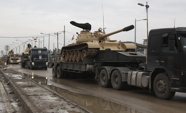 Kurdish Peshmerga armoured vehicles are transported on trucks on the outskirts of Kirkuk, some 250km (155 miles) north of Baghdad, November 24, 2012. Iraq's Kurdish region has sent reinforcements to a disputed area where its troops are involved in a standoff with the Iraqi army, a senior Kurdish military official said, despite calls on both sides for dialogue to calm the situation. Picture taken November 24, 2012. Kurdish Peshmerga armoured vehicles are transported on trucks on the outskirts of Kirkuk, some 250km (155 miles) north of Baghdad, November 24, 2012. Iraq's Kurdish region has sent reinforcements to a disputed area where its troops are involved in a standoff with the Iraqi army, a senior Kurdish military official said, despite calls on both sides for dialogue to calm the situation. Picture taken November 24, 2012.