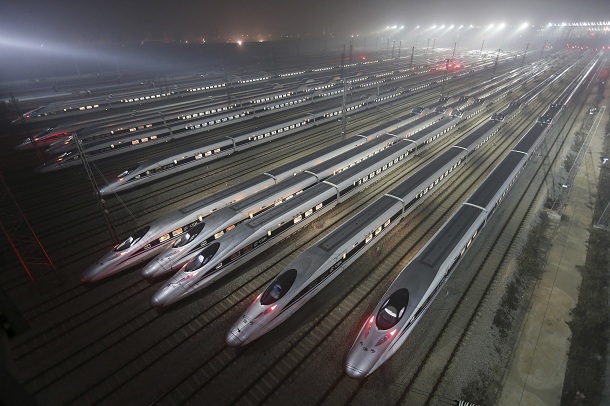 CRH380 (China Railway High-speed) Harmony bullet trains are seen at a high-speed train maintenance base in Wuhan, Hubei province, early December 25, 2012. China will open the world's longest high-speed rail line this week when a link between Beijing and the southern metropolis of Guangzhou is inaugurated, officials said on Saturday, underscoring its commitment to a trouble-plagued transport scheme. Rail investment slowed sharply in the wake of that accident and state media reported earlier this year that the government had cut planned railway investment by 500 billion yuan ($80.27 billion) to 2.3 trillion yuan under a five-year plan to 2015. CRH380 (China Railway High-speed) Harmony bullet trains are seen at a high-speed train maintenance base in Wuhan, Hubei province, early December 25, 2012. China will open the world's longest high-speed rail line this week when a link between Beijing and the southern metropolis of Guangzhou is inaugurated, officials said on Saturday, underscoring its commitment to a trouble-plagued transport scheme. Rail investment slowed sharply in the wake of that accident and state media reported earlier this year that the government had cut planned railway investment by 500 billion yuan ($80.27 billion) to 2.3 trillion yuan under a five-year plan to 2015.