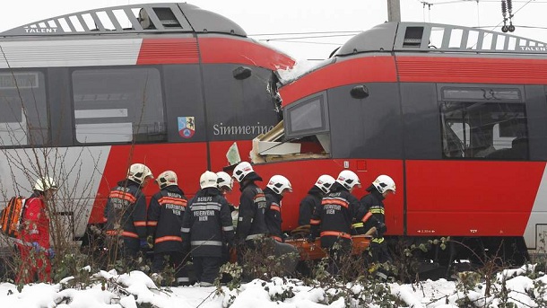Austrian rescue personnel carries an injured person in front of two demolished S45 trains after a train crash in Vienna January 21, 2013. Two trains collided Monday morning, injuring 25 people, police said. Austrian rescue personnel carries an injured person in front of two demolished S45 trains after a train crash in Vienna January 21, 2013. Two trains collided Monday morning, injuring 25 people, police said.