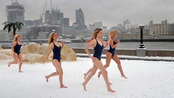 Models run through the snow beside Tower Bridge as Hilton Hotels & Resorts create a pop-up beach beside the river Thames, London, on the day that is considered by many as the most depressing day of the year. Models run through the snow beside Tower Bridge as Hilton Hotels & Resorts create a pop-up beach beside the river Thames, London, on the day that is considered by many as the most depressing day of the year.