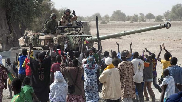 In this Monday, Jan. 28, 2013, photo provided by the French Army Communications Audiovisual office (ECPAD) and released Tuesday, Jan. 29, 2013, a crowd cheers the arrival of French soldiers in Timbuktu, in northern Mali. Backed by French helicopters and paratroopers, Malian soldiers entered the fabled city of Timbuktu on Monday after al-Qaida-linked militants who ruled the outpost by fear for nearly 10 months fled into the desert, setting fire to a library that held thousands of manuscripts dating to the Middle Ages. In this Monday, Jan. 28, 2013, photo provided by the French Army Communications Audiovisual office (ECPAD) and released Tuesday, Jan. 29, 2013, a crowd cheers the arrival of French soldiers in Timbuktu, in northern Mali. Backed by French helicopters and paratroopers, Malian soldiers entered the fabled city of Timbuktu on Monday after al-Qaida-linked militants who ruled the outpost by fear for nearly 10 months fled into the desert, setting fire to a library that held thousands of manuscripts dating to the Middle Ages.