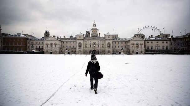 LONDON, UNITED KINGDOM - JANUARY 21: A man walks across a snowy Horse Guards Parade on January 21, 2013 in London, England. The United Kingdom has suffered a weekend of heavy snowfall with many transport routes affected. LONDON, UNITED KINGDOM - JANUARY 21: A man walks across a snowy Horse Guards Parade on January 21, 2013 in London, England. The United Kingdom has suffered a weekend of heavy snowfall with many transport routes affected.
