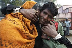 A person consoling his relative, who lost his near one in stampede. File Pic