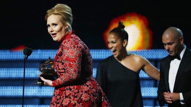 Adele holds the Grammy for Best Pop Solo Performance for her song "Set Fire To The Rain " at the 55th annual Grammy Awards in Los Angeles, California, February 10, 2013. Adele holds the Grammy for Best Pop Solo Performance for her song "Set Fire To The Rain " at the 55th annual Grammy Awards in Los Angeles, California, February 10, 2013.