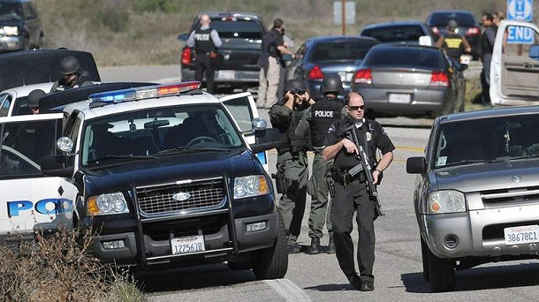 Redlands Police officers man a blockade near the entrance to the San Bernardino National Forest in southern California after Christopher Dorner, a fugitive ex-Los Angeles cop sought in three killings, engaged in a shootout with authorities that wounded two officers in the San Bernardino Mountains near Big Bear Lake, Tuesday, Feb. 12, 2013. Redlands Police officers man a blockade near the entrance to the San Bernardino National Forest in southern California after Christopher Dorner, a fugitive ex-Los Angeles cop sought in three killings, engaged in a shootout with authorities that wounded two officers in the San Bernardino Mountains near Big Bear Lake, Tuesday, Feb. 12, 2013.