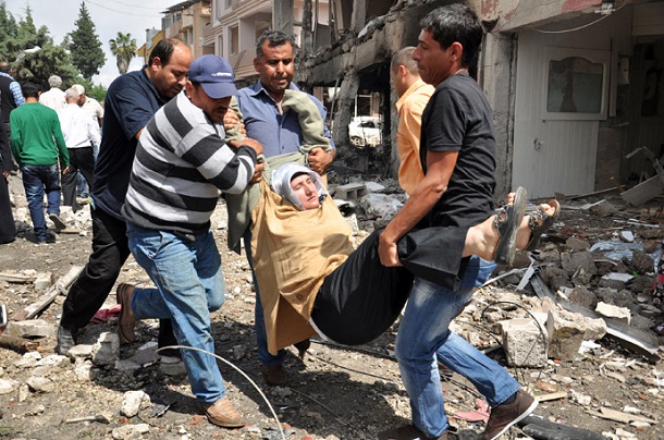 A person is evacuated from the site where car bombs exploded on May 11, 2013 near the town hall in Reyhanli, just a few kilometres from the main border crossing into Syria A person is evacuated from the site where car bombs exploded on May 11, 2013 near the town hall in Reyhanli, just a few kilometres from the main border crossing into Syria