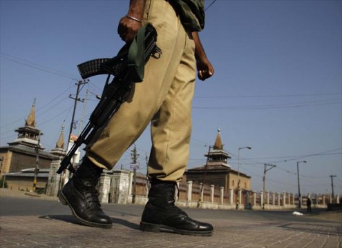 Indian paramilitary soldier maintains guard in Indian Kashmir.