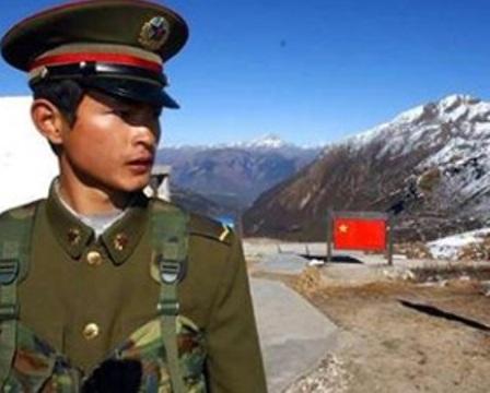 A Chinese soldier keeps guard on India border. File Pic