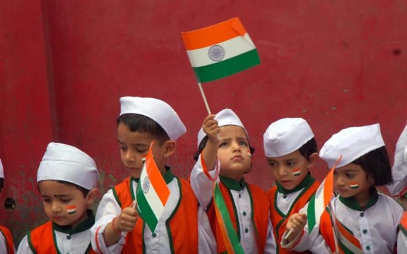 Children with Indian flags during I-Day function in India. 