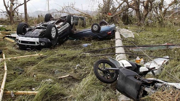 Overturned vehicles are seen at a rice field after super Typhoon Haiyan battered Tacloban city Overturned vehicles are seen at a rice field after super Typhoon Haiyan battered Tacloban city