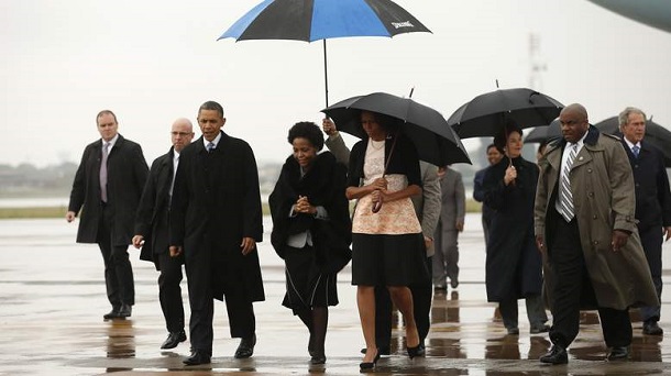 U.S. President Barack Obama and first lady Michelle Obama are escorted upon their arrival on Air Force One to attend a memorial service for Nelson Mandela in Johannesburg U.S. President Barack Obama and first lady Michelle Obama are escorted upon their arrival on Air Force One to attend a memorial service for Nelson Mandela in Johannesburg
