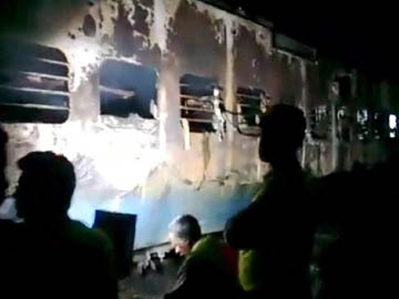One of the burnt coaches of train in India.