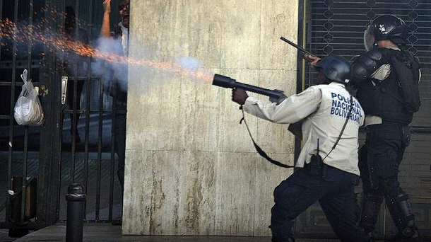Venezuelan riot police opening fire against protestsers Venezuelan riot police opening fire against protestsers