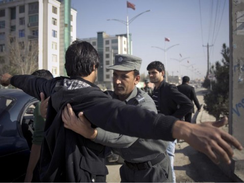 Afghanistan security men frisking a passerby. File pic