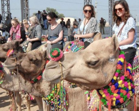 Foreign tourists enjoying camel ride in India: File Pic