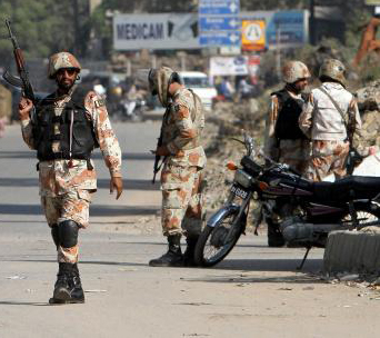 Pakistan soldiers securing blast site. File pic