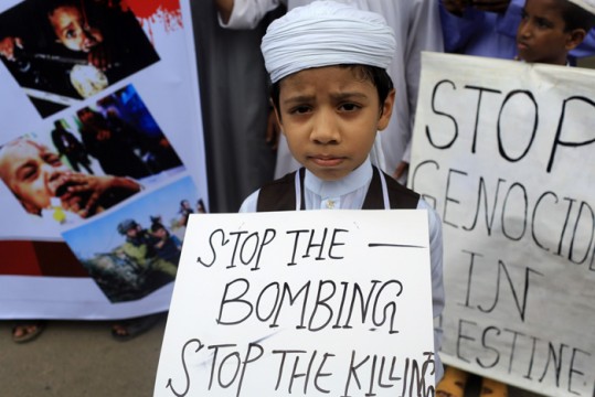 A child part of demonstration in Bangladesh demands end to killings in Gaza. File Pic
