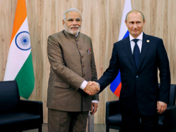 Indian PM and Russian president shaking hands. File Pic