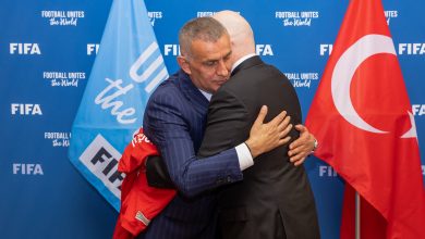 FIFA President Gianni Infantino is presented with a Hakan Çalhanoglu jersey by Turkish Football Federation President Ibrahim Ethem Haciosmanoglu during a meeting between FIFA and meeting with Turkish Football Federation