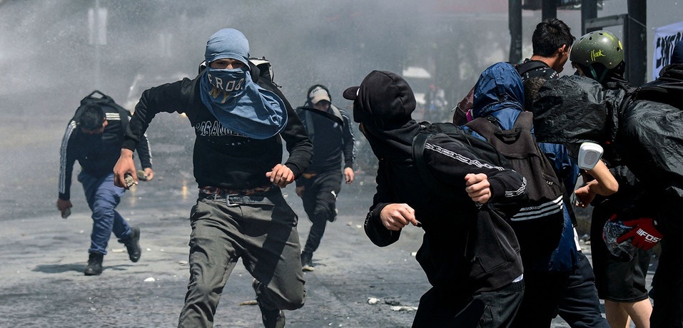 Clashes between Chilean students and police in the capital of Chile, Santiago. 