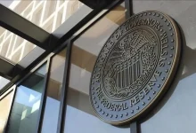 The Fed lowered its benchmark interest rate by 0.25 percentage points to a range of 3.75–4%, citing growing risks to employment.