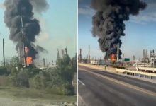 A powerful explosion at an oil refinery in Port Arthur, Texas, triggered a fire and sent thick black smoke into the sky.